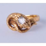 An antique diamond set snake ring, unmarked, size L.