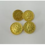 A pair of gold cufflinks set with four 1853 US dollar coins, approx. 7.70g.