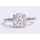 A 18ct white gold diamond set cluster engagement ring, with insurance valuation (dated 2012)