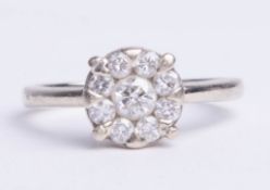 A 18ct white gold diamond set cluster engagement ring, with insurance valuation (dated 2012)