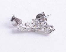 A pair 18ct diamond three stone earrings, each set with three graduated diamonds, length 11mm.