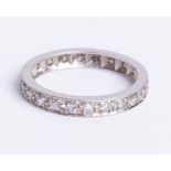 An unmarked, white gold? 22 stone diamond full eternity ring, size K.