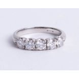 A platinum and diamond five stone ring, new circa 2010, size L/M.