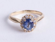A 14ct sapphire and diamond set cluster ring, size K.