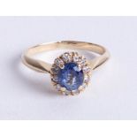 A 14ct sapphire and diamond set cluster ring, size K.