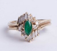A 14k gold emerald and diamond cluster ring, size O.