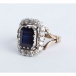 A late Victorian sapphire and diamond cluster ring, head size 17mm x 13mm, size P.