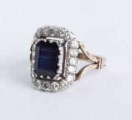 A late Victorian sapphire and diamond cluster ring, head size 17mm x 13mm, size P.