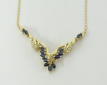 A 14k sapphire and diamond necklet set in yellow gold.