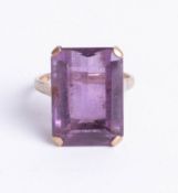 A 9ct gold rectangular amethyst, stone 13mm x 17mm, size M.