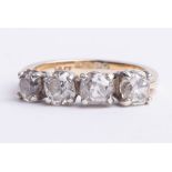 An 18ct four stone diamond ring, set with old cut round diamonds, size M.