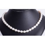 Single row baroque freshwater Pearl necklet with silver ball clasp.
