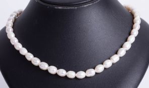 Single row baroque freshwater Pearl necklet with silver ball clasp.