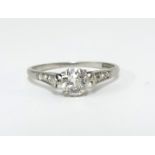 A platinum and diamond solitaire ring, size L.