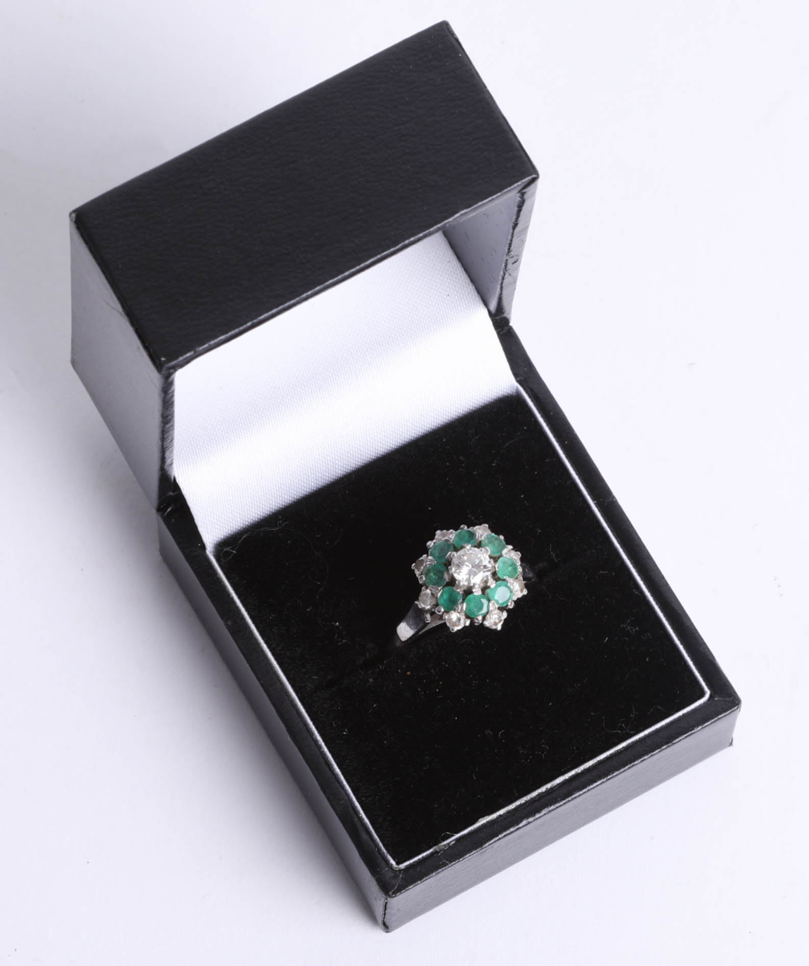 A platinum and 18ct gold diamond and emerald cluster ring, size O. - Image 2 of 2