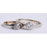 An 18ct white gold and diamond set solitaire ring and another (2).