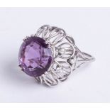 A large unmarked, white gold? seven stone amethyst and diamond cluster ring, size M.