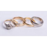 Four rings including an 18ct diamond cluster, 18ct band ring 4.70g, a 9ct band ring 3.10g (4)