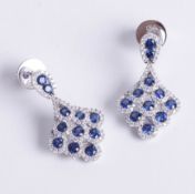 A fine pair of 18ct diamond and sapphire set earrings, matching lot 81.