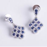 A fine pair of 18ct diamond and sapphire set earrings, matching lot 81.