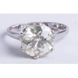 A large diamond solitaire ring, approx 3.56 carats, cushion shaped and old brilliant cut diamond,