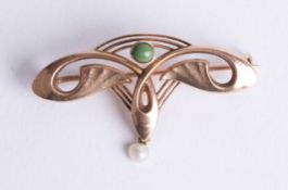 A 9ct Art Nouveau style brooch set with green hardstone.