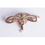 A 9ct Art Nouveau style brooch set with green hardstone.