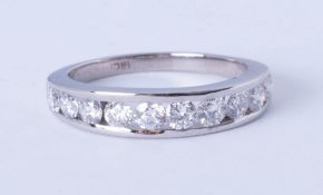 An 18ct white gold diamond 10 stone eternity ring, approx 75 pts, size O.