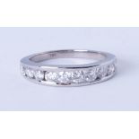 An 18ct white gold diamond 10 stone eternity ring, approx 75 pts, size O.