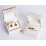 A pair of amber earrings and similar ring, size P.