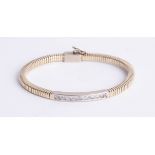 A yellow gold and diamond set bracelet, indistinctly marked.