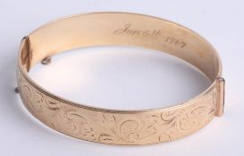 A cross over bangle marked '9ct and bronze core', also a turquoise and silver pendant, earrings