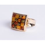 A 14ct yellow gold square dress ring, comprising four rows of four mixed colured amber stones cut