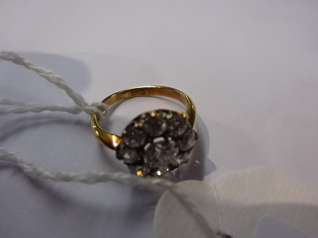 An 18ct nine stone diamond cluster ring, size K. - Image 3 of 6