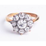 An 18ct nine stone diamond cluster ring, size K.