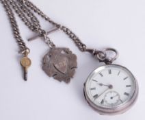 A silver pocket watch, sub seconds, key wind and albert.