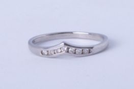 A platinum and diamond wishbone ring, approx 2.40g. size L.