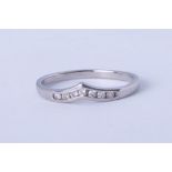 A platinum and diamond wishbone ring, approx 2.40g. size L.