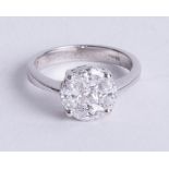 An 18ct diamond cluster ring, set with marquise and princess cut diamonds, diameter 9mm, approx 1.25