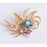 A 9ct yellow gold leaf design brooch, central cluster formation comprising six blue zircons and one