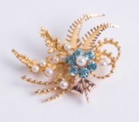 A 9ct yellow gold leaf design brooch, central cluster formation comprising six blue zircons and one