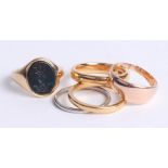 A 9ct signet ring 6.2g, a 22ct wedding band 3.1g and three other various rings including platinum