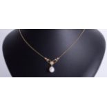 An 18ct diamond necklace, set with oval shaped freshwater pearl pendant with flower design bar set