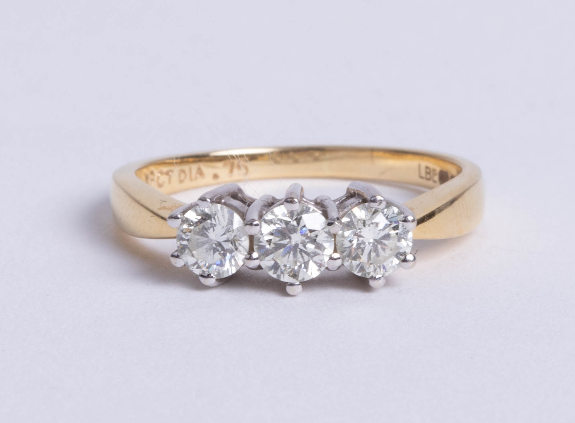 A diamond three stone ring, approx 75 pts, size N.