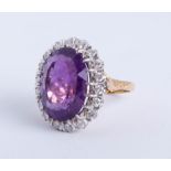 A large amethyst and diamond cluster ring, size R.
