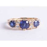 An antique 18ct diamond and sapphire ring, size J.