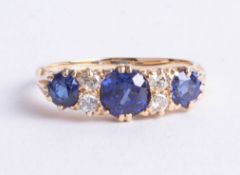 An antique 18ct diamond and sapphire ring, size J.