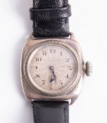 A vintage cushion cased silver wristwatch with manual movement and sub seconds, probably Rolex,
