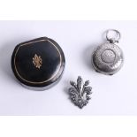 A Victorian silver sovereign holder and a fleur-de-lis medallion with box (2).