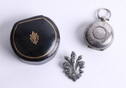 A Victorian silver sovereign holder and a fleur-de-lis medallion with box (2).